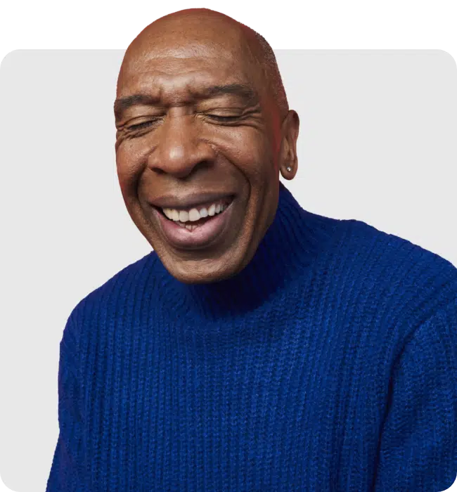 man smiling wearing jumper