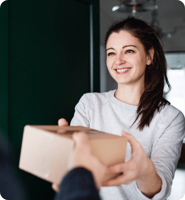 Industry viewpoint of a woman receiving a package.
